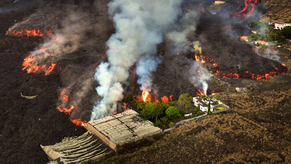 Lava flows destroying houses and banana plantations as volcano continues to erupt on the Canary island of La Palma, Spain, Friday, Oct. 29, 2021. An erupting volcano in the Spanish island of La Palma continued to emit vast amounts of magma, gases and ash on Friday, after days of intense seismic activity and more than five weeks since it erupted. (AP Photo/Emilio Morenatti)