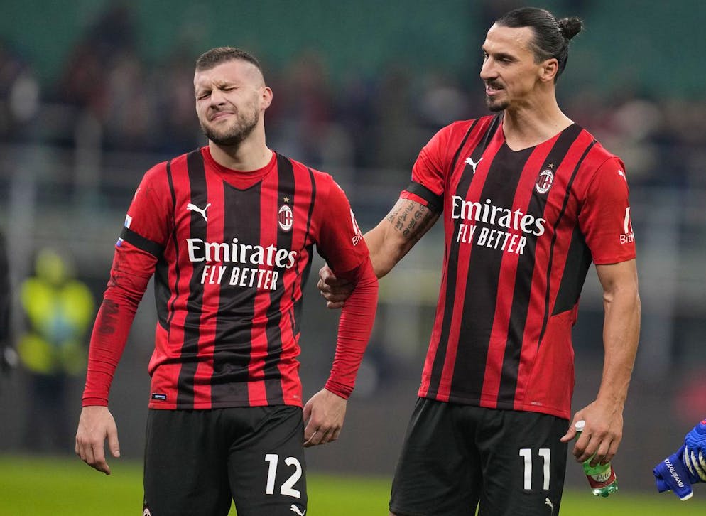 AC Milan's Ante Rebic, left, and AC Milan's Zlatan Ibrahimovic leave the pitch at the end of the Serie A soccer match between AC Milan and Inter Milan at the San Siro stadium, in Milan, Italy, Sunday, Nov. 7, 2021. (AP Photo/Antonio Calanni)