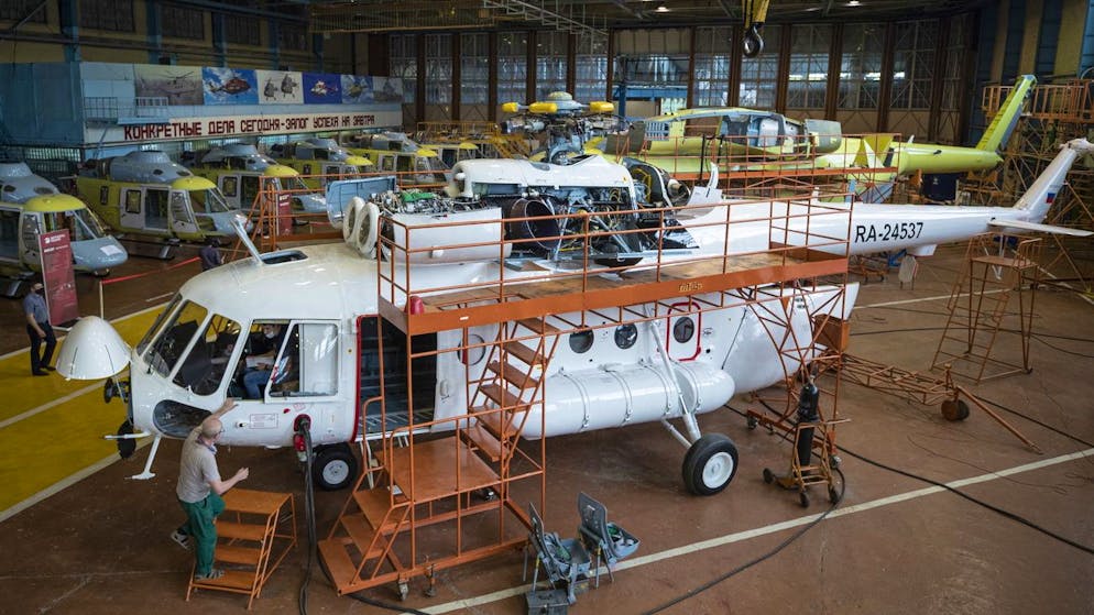 epa08539859 Workers assemble a Mi-17 helicopter at Kazan Helicopter Plant in Kazan, Russia, 10 July 2020 (issued 11 July 2020). Kazan Helicopter Plant is a part of JSC Russian Helicopters (part of Rostec State Corporation), one of the world leaders in helicopter industry. The plant has been certified for the production and repairs of all modifications of Mi-8, Mi-17, Mi-38 and new light twin-engine multi-purpose helicopter Ansat. The holding company is comprised of five helicopter plants, two design bureaus, enterprises for production and maintenance of components, aircraft repair plants and a service company providing after-sales support in Russia and abroad. EPA/SERGEI ILNITSKY