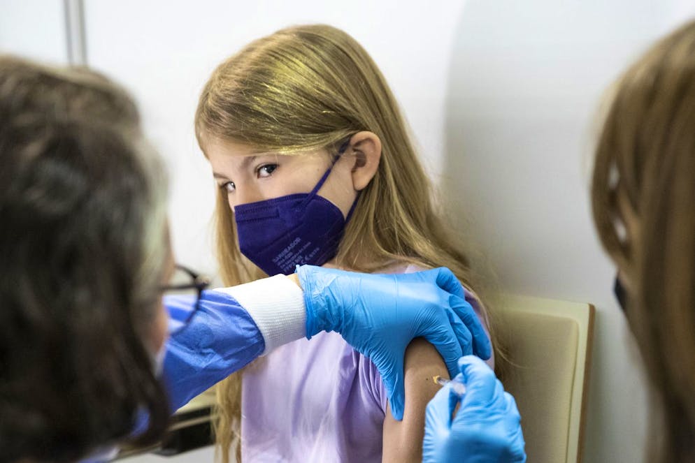 A young patient receives the Pfizer vaccine against the COVID-19 disease. The official vaccination for children between the age of 5 and 12 years start today in Vienna, Austria, Monday, Nov. 15, 2021. (AP Photo/Lisa Leutner)