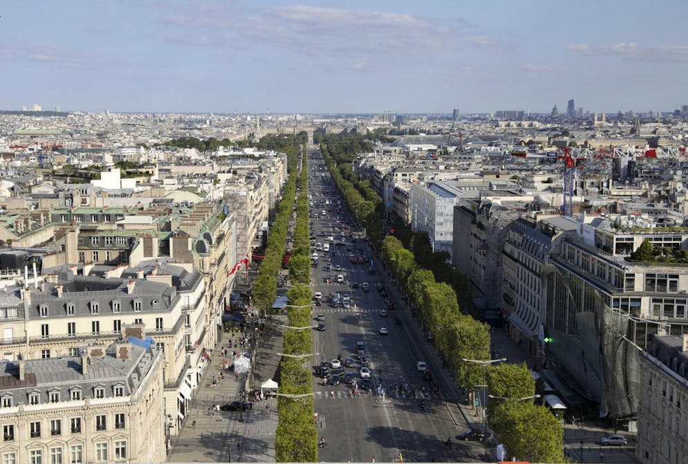 The Champs-Elysees avenue is pictured from the top of the Arc de Triomphe, Tuesday, Aug.24, 2021. (AP Photo/Adrienne Surprenant)