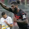 AC Milan's Franck Kessie celebrates after scoring his side's second goal from the penalty spot during the Serie A soccer match between AC Milan and Verona at the San Siro stadium, in Milan, Italy, Saturday, Oct. 16, 2021. (AP Photo/Antonio Calanni)
