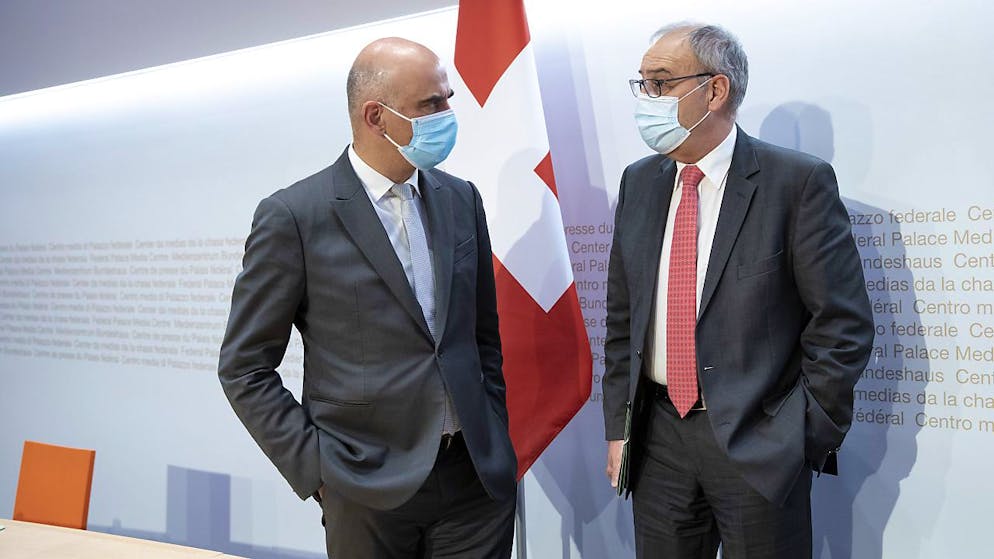 Il consigliere federale Alain Berset e il presidente della Confederazione Guy Parmelin