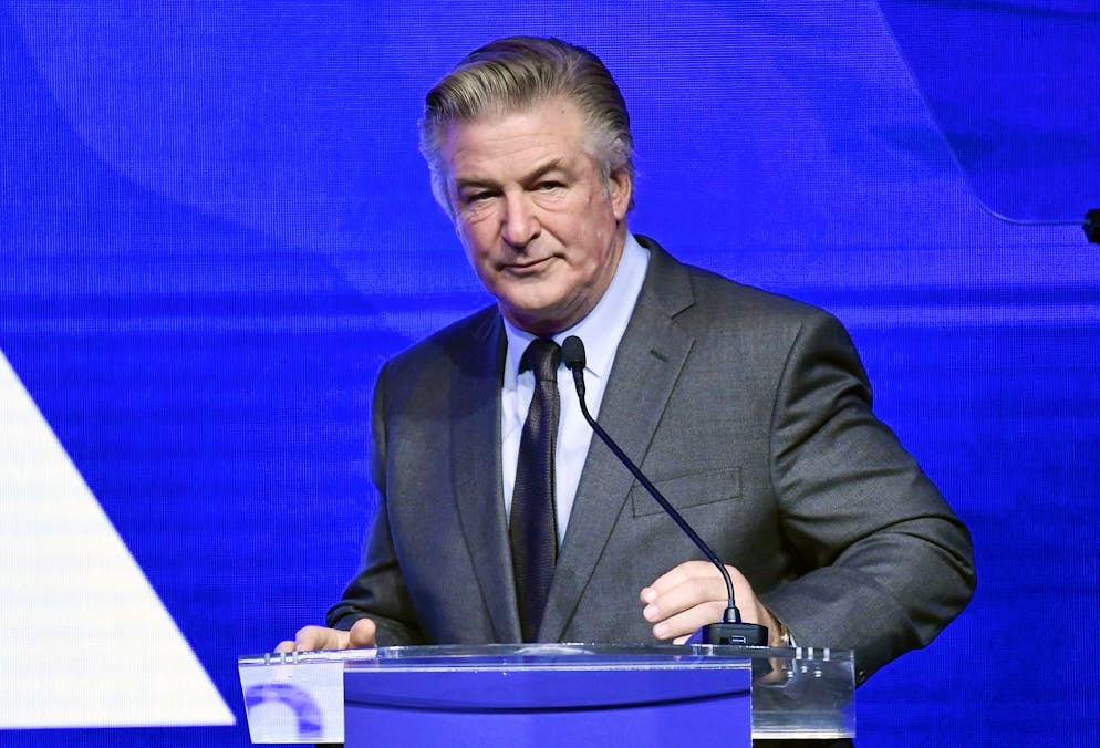 FILE - Alec Baldwin performs emcee duties at the Robert F. Kennedy Human Rights Ripple of Hope Award Gala at New York Hilton Midtown on Dec. 9, 2021, in New York. Authorities on Thursday, Dec. 16, 2021, issued a search warrant for Baldwin's cell phone, saying it could hold evidence that might be helpful as they investigate a deadly shooting on a New Mexico film set that killed a cinematographer and wounded the director. (Photo by Evan Agostini/Invision/AP, File)