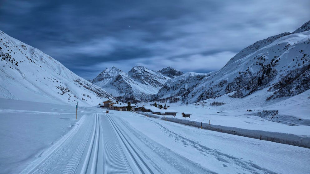 Village of Sertig during a night of full moon. Sertig Dorfli, Davos, Albula Valley, Canton of Grisons, Switzerland, Europe.