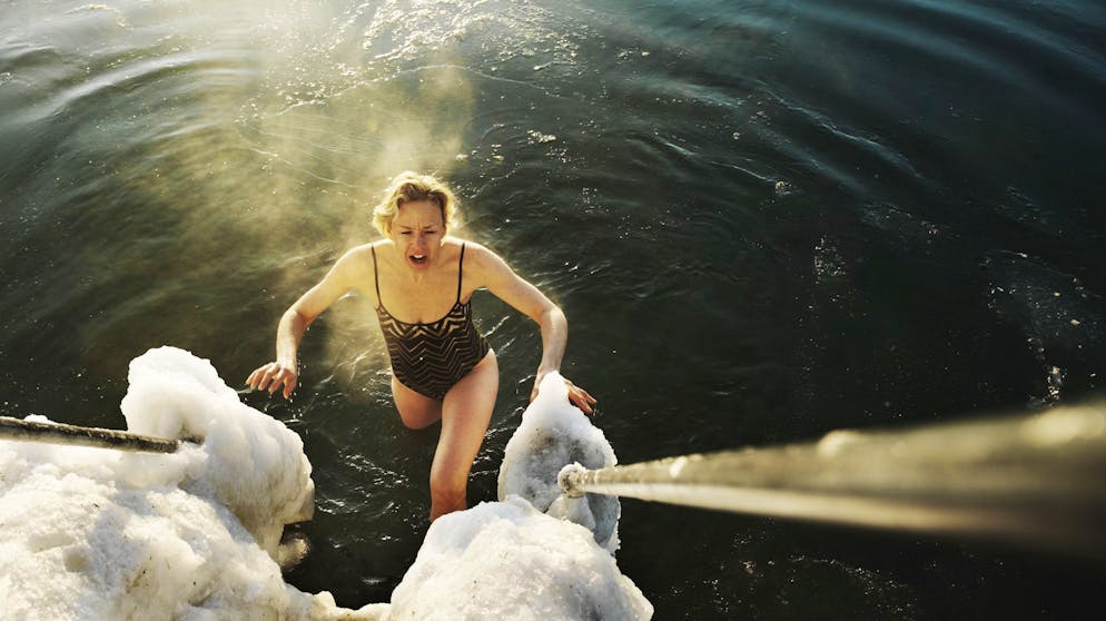 A viking winter bather steaming in the early morning sunlight.