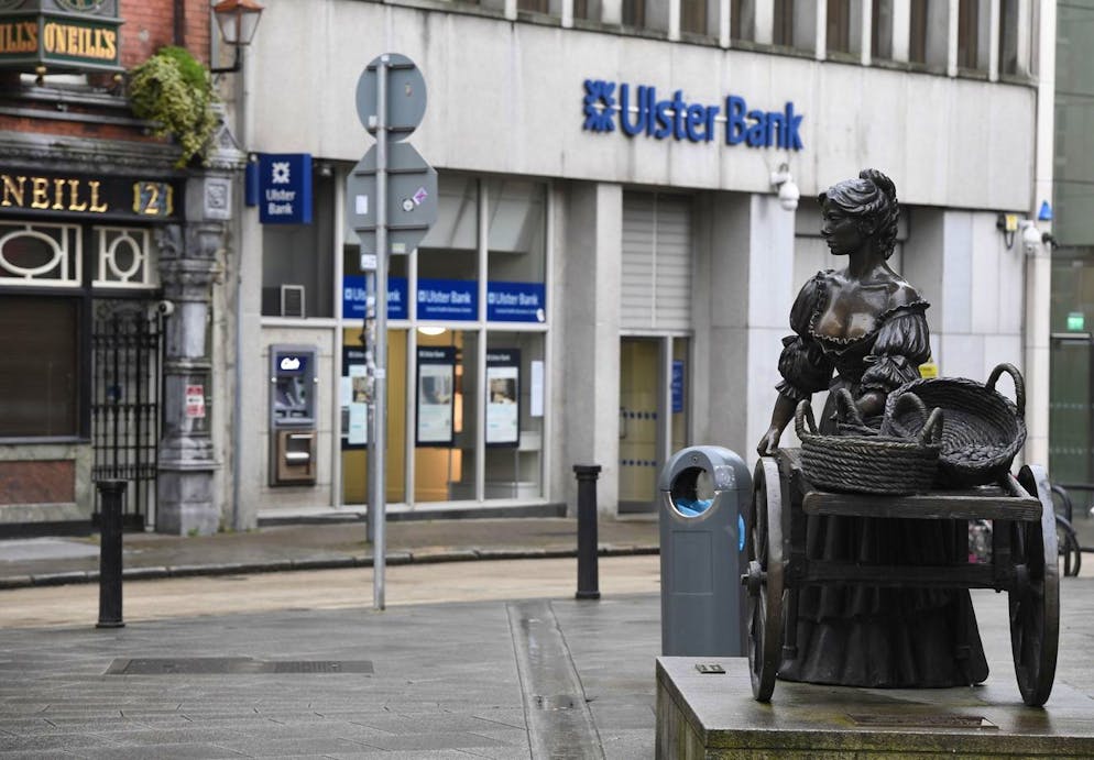 epa09023242 A branch of Ulster Bank backdrops the statue of Molly Malone in Dublin, Ireland, 19 February 2021. Irish lender NatWest on 19 February 2021 confirmed it was withdrawing its brand Ulster Bank from the Republic of Ireland market. EPA/AIDAN CRAWLEY