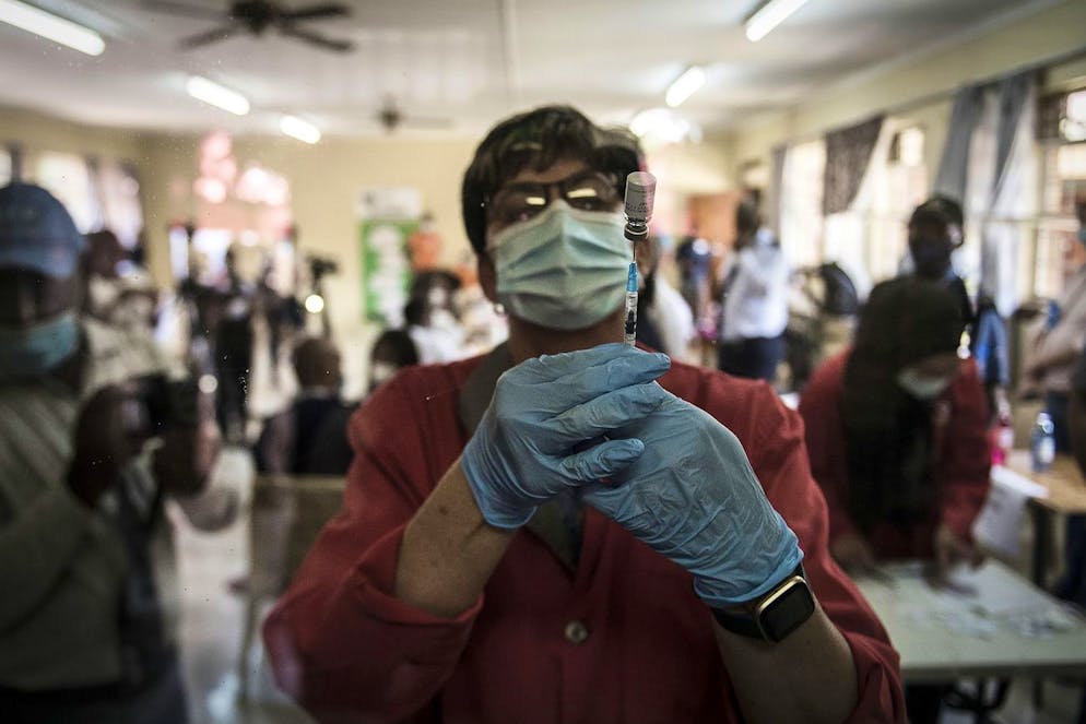 A pharmacist prepares the Johnson & Johnson Covid-19 vaccine to administer to health care workers at the government hospital in Klerksdorp, South Africa, Thursday, Feb. 18, 2021. South Africa started the rollout of vaccines Wednesday with South African President Cyril Ramaphosa among the first in his country to receive the vaccine in the inoculation drive in the country. (AP Photo/Shiraaz Mohamed)