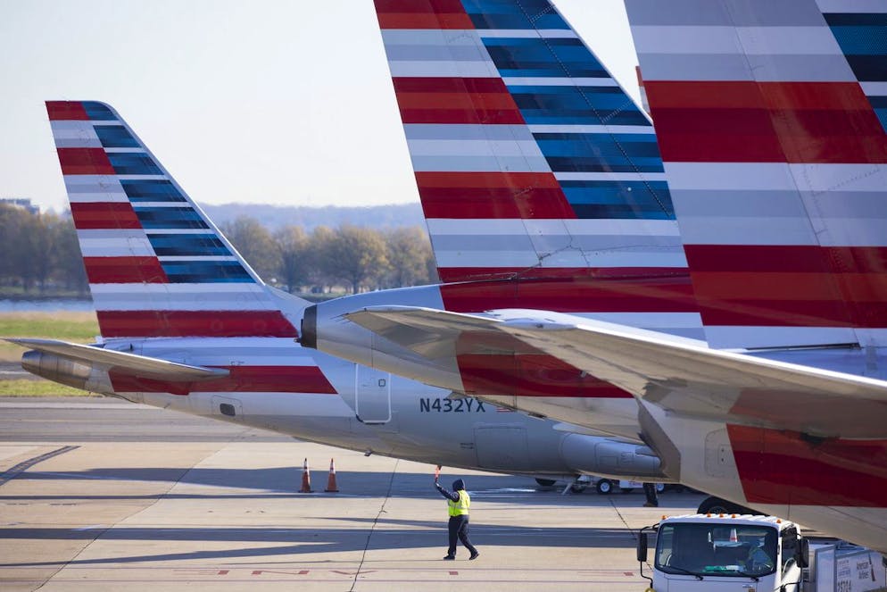 epa08839480 An American Airlines plane taxis on the tarmac at Ronald Reagan Washington National Airport in Arlington, Virginia, USA, 24 November 2020. The US Centers for Disease Control and Prevention (CDC) has recommended against travel during the Thanksgiving Day period, which is typically the busiest travel time of the year. The US has seen a surge of coronavirus COVID-19 infections and hospitalizations. EPA/MICHAEL REYNOLDS
