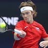 Russia's Andrey Rublev makes a forehand return to Argentina's Guido Pella during their ATP Cup match in Melbourne, Australia, Tuesday, Feb. 2, 2021. (AP Photo/Hamish Blair)