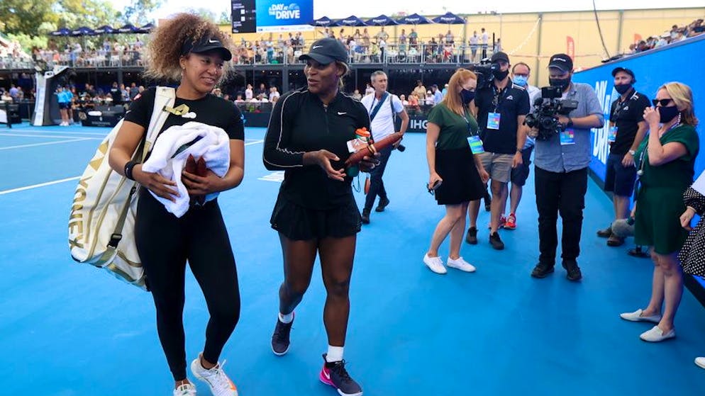 epa08972350 Naomi Osaka (L) of Japan and Serena Williams (2-L) of the USA walk from the court together during the 'A Day at the Drive' tennis event at Memorial Drive Tennis Centre in Adelaide, Australia, 29 January 2021. EPA/KELLY BARNES AUSTRALIA AND NEW ZEALAND OUT