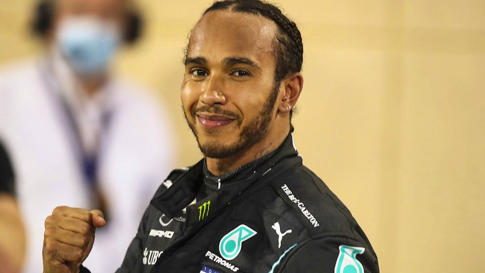 epa08851492 British Formula One driver Lewis Hamilton of Mercedes-AMG Petronas celebrates after winning the 2020 Formula One Grand Prix of Bahrain at Bahrain International Circuit near Manama, Bahrain, 29 November 2020. EPA/TOLGA BOZOGLU / POOL