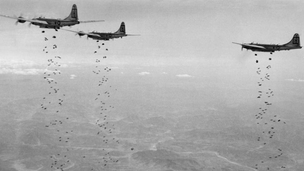** ADVANCE FOR USE SUNDAY, OCT. 10, 2010 AND THEREAFTER ** FILE - In this Jan. 18, 1951 file picture provided by the U.S. Air Force, B-29 planes of the U.S. Far East Air Forces drop high-demolition bombs on Chinese troops in North Korea. Three months earlier, such Air Force bombers ran nuclear rehearsal runs over North Korea's capital. Sixty years after the start of the Korean War, recently released declassified documents have helped fill in the history of U.S. nuclear threats against North Korea over the decades. (AP Photo/U.S. Air Force)
