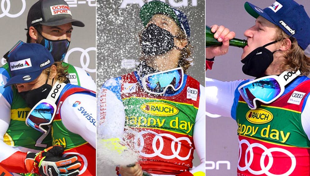 Runner-up Loic Meillard, left, and winner Marco Odermatt, both from Switzerland, celebrate on the podium of an alpine ski, the men's giant slalom of the World Cup in Kranjska Gora, Slovenia, on Saturday, March 13 2021 (AP Photo / Marco Trovati).