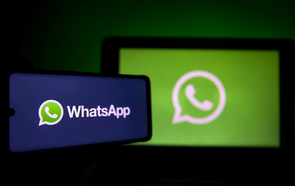 epa08967944 A photo illustration shows the logo of social media messaging application Whatsapp on a computer and a mobile telephone screen, in Paris, France, 27 January 2021. The popular application (app) Whatsapp has faced backlash after announcing on 04 January a change to its privacy policy under which users widely interpreted that personal information would be shared with the app's parent company, Facebook. Although the policy change allegedly was only to affect interactions with business accounts, it prompted millions of users to migrate to rival messaging applications such as Signal and Telegram. EPA/IAN LANGSDON