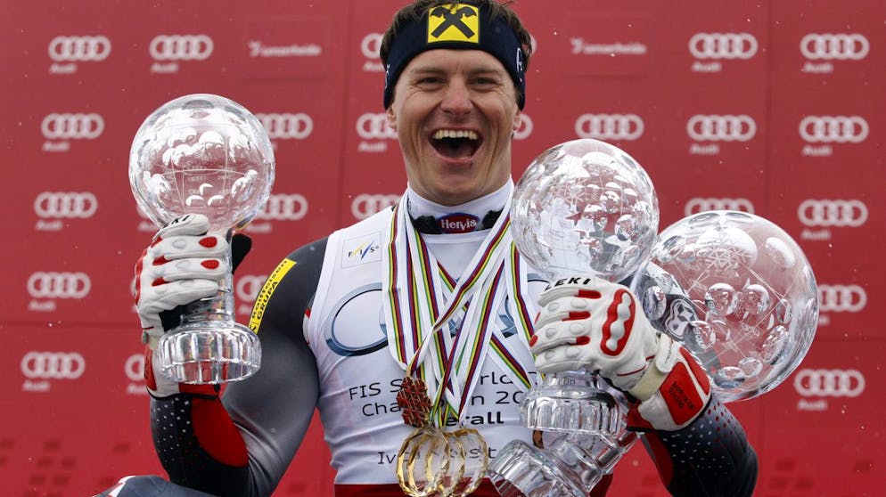 Croatia's Ivica Kostelic shows his trophies of the alpine ski, men's World Cup super-combined, slalom and overall titles, at the World Cup finals in Lenzerheide, Switzerland, Saturday, March 19, 2011. (AP Photo/Alessandro Trovati)
