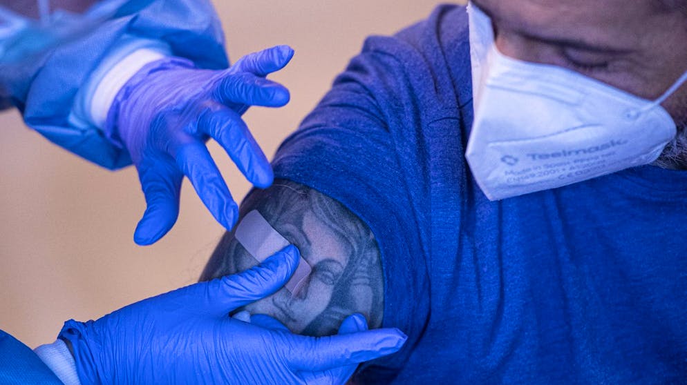 Javier Crespo after receiving a dose of the AstraZeneca COVID-19 vaccine, during a mass vaccination campaign at San Pedro Hospital, in Logrono, northern Spain, Wednesday, March 24, 2021. Spain resumed the use of the AstraZeneca vaccine on Wednesday. (AP Photo/Alvaro Barrientos)