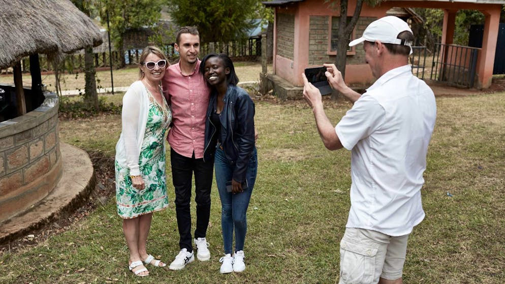 ITEN, KENYA - FEBRUARY 21, 2021. Julien Wanders, 24, is a Swiss long-distance runner. He currently has the European record for the half marathon with a time of 59:13, which was set at the Ras Al Khaimah Half Marathon in 2019 and the European record for the 10K run, with a time of 27:13 set in Valencia on January 12, 2020. He lives and trains in Iten, Kenya, with a group of pan-african runners. He is pictured here at Lelin Overland Campsite, attending a birthday party with his girfriend Kolly, his mother Bénédicte, and friends. CREDIT: ELISABETH REAL