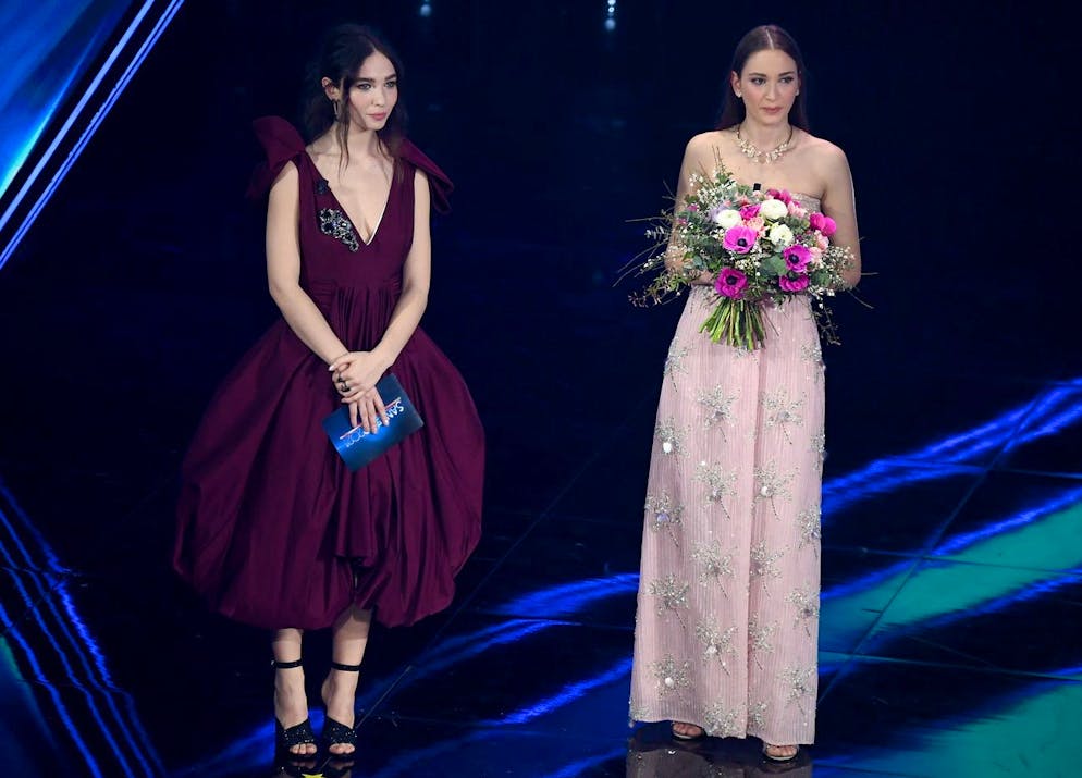 epa09047492 Italian actress Matilda De Angelis (L) and Alessia Bonari (R), appear on stage of the Ariston theatre during the 71st Sanremo Italian Song Festival, Sanremo, Italy, 02 March 2021. The festival runs from 02 to 06 March 2021. Bonari is a nurse of a hospital in Milan who became a symbol of the fight against COVID-19 when a photo of her, taken at the beginning of March with the lockdown just started, showed her swollen face from wearing a protective mask during a very long shift, went viral on the Internet. EPA/ETTORE FERRARI