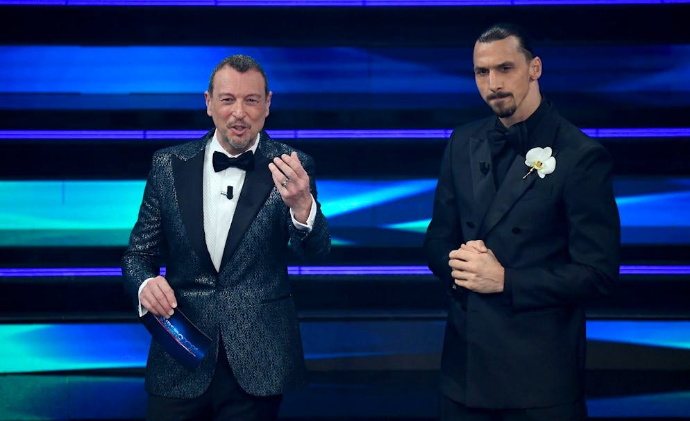 epa09047754 Sanremo Festival host and artistic director Amadeus (L) and Milan's Swedish forward Zlatan Ibrahimovic (R) perform on stage at the Ariston theatre during the 71st Sanremo Italian Song Festival, in Sanremo, Italy, 02 March 2021. The festival runs from 02 to 06 March. EPA/ETTORE FERRARI