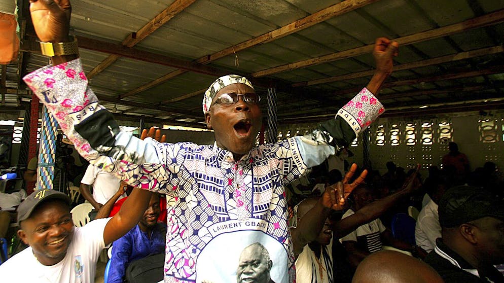 Supporters of former Ivory Coast President Laurent Gbagbo celebrate in Abidjan Wednesday March 31, 2021, after the International Criminal Court appeals judges in The Hague upheld the acquittals of Gbagbo and former minister Charles Ble Goude on charges of involvement in deadly post-election violence. Both were acquitted in 2019 of responsibility for crimes including murder, rape and persecution following disputed elections in 2010, with judges saying prosecutors failed to prove their case. (AP Photo/ Diomande Ble Blonde)