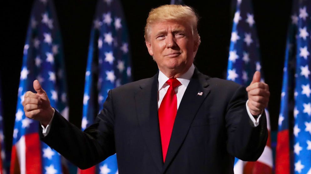 CLEVELAND, OH - JULY 21: Republican presidential candidate Donald Trump gives two thumbs up to the crowd during the evening session on the fourth day of the Republican National Convention on July 21, 2016 at the Quicken Loans Arena in Cleveland, Ohio. Republican presidential candidate Donald Trump received the number of votes needed to secure the party's nomination. An estimated 50,000 people are expected in Cleveland, including hundreds of protesters and members of the media. The four-day Republican National Convention kicked off on July 18. (Photo by Chip Somodevilla/Getty Images)