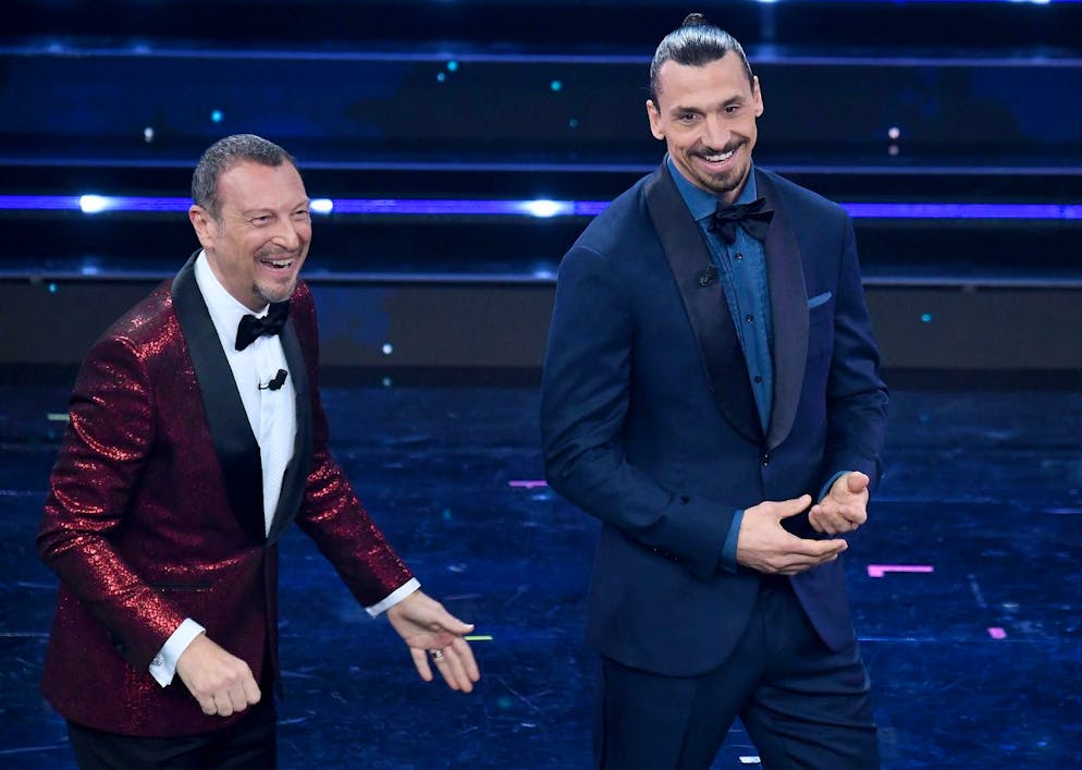 epa09052773 Sanremo Festival host and artistic director, Amadeus (L) appears with Milan's Swedish forward Zlatan Ibrahimovic (R) on stage at the Ariston theatre during the 71st Sanremo Italian Song Festival, in Sanremo, Italy, 04 March 2021. The festival runs from 02 to 06 March. EPA/ETTORE FERRARI