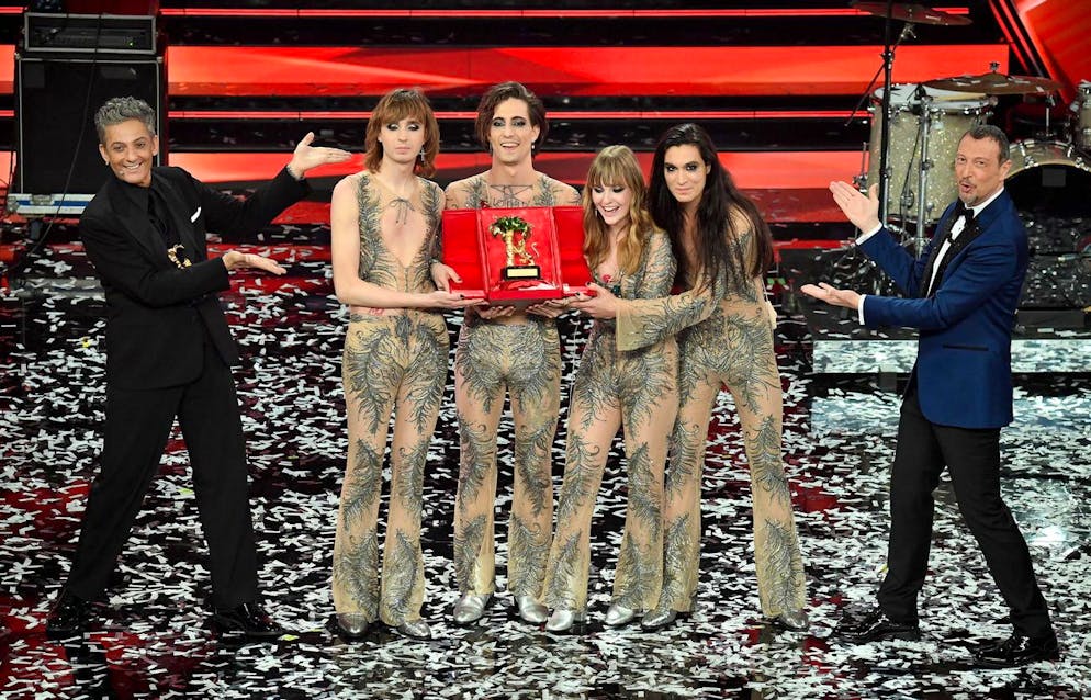 epa09058327 Sanremo Festival host and artistic director, Amadeus (R), and Italian showman Rosario Fiorello (L) stand with Italian band Maneskin while they pose with the prize after winning the 71st Sanremo Italian Song Festival, Sanremo, Italy, 06 March 2021. EPA/ETTORE FERRARI