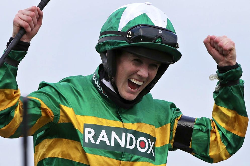 Rachael Blackmore ridding Minella Times celebrates after winning the Randox Grand National Handicap Chase on the third day of the Grand National Horse Racing meeting at Aintree racecourse, near Liverpool, England, Saturday April 10, 2021. (AP Photo/Scott Heppell, Pool)