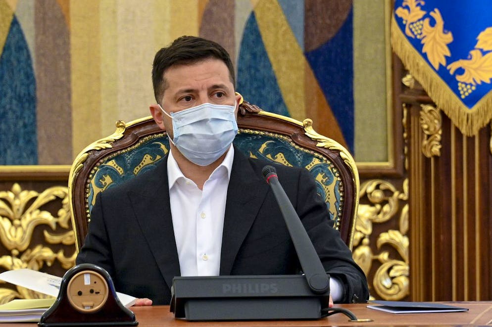 In this photo released by Ukrainian Presidential Press Office, Ukrainian President Volodymyr Zelenskyy leads a meeting of the National Security and Defense Council in Kyiv, Ukraine, Thursday, April 15, 2021. Ukraine's President Volodymyr Zelensky is heading Friday to Paris to discuss the tensions with French President Emmanuel Macron. (Ukrainian Presidential Press Office via AP)
