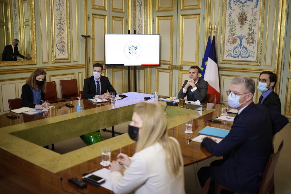 epa09049248 French President Emmanuel Macron (C) participates in the Act-A videoconference meeting with the African Union board at the Elysee Palace in Paris, France, 03 March 2021. The Act-A launched by the World Health Organization is the initiative to coordinate a global response to the Covid-19 pandemic. EPA/YOAN VALAT / POOL