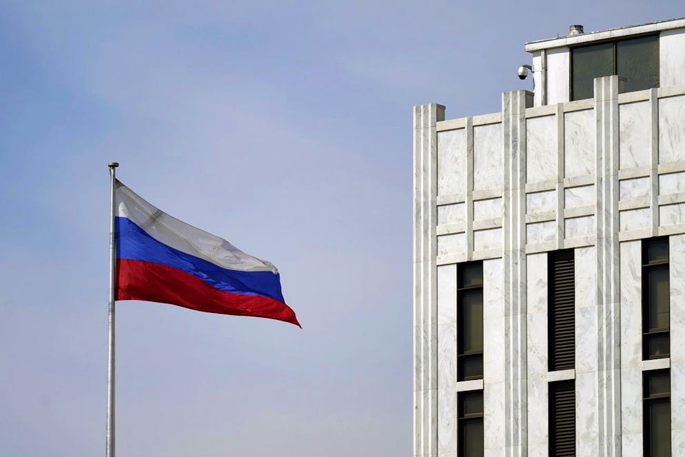 The Russian flag flies on the grounds of the Embassy of the Russian Federation in Washington, Thursday, April 15, 2021. The Biden administration has rolled out a sweeping set of sanctions on Russia over its election interference, hacking efforts and other malign activity. (AP Photo/Carolyn Kaster)
