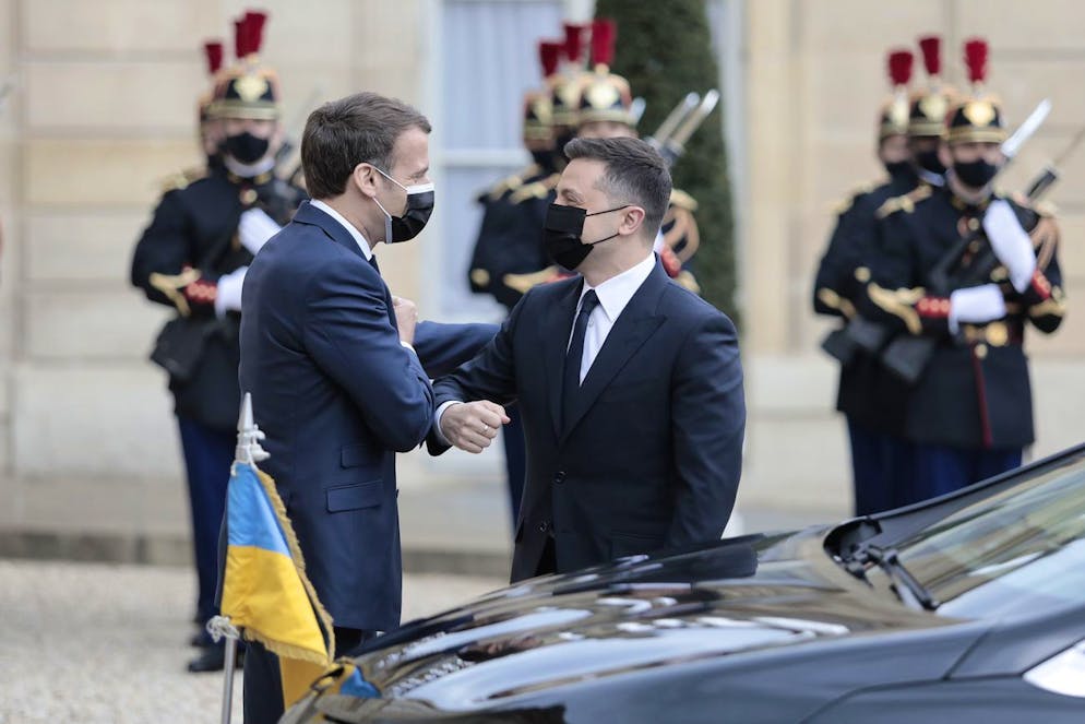 French President Emmanuel Macron, left, welcomes Ukrainian President Volodymyr Zelenskyy before a working lunch at the Elysee palace in Paris, Friday, April 16, 2021. Ukrainian President Volodymyr Zelenskyy is holding talks with French President Emmanuel Macron and German Chancellor Angela Merkel amid growing tensions with Russia, which has deployed troops at the border with the country. (AP Photo/Lewis Joly)