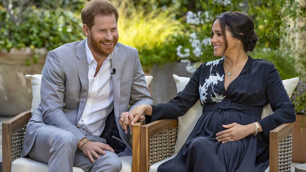 This image provided by Harpo Productions shows Prince Harry, left, and Meghan, Duchess of Sussex, speaking about expecting their second child during an interview with Oprah Winfrey.