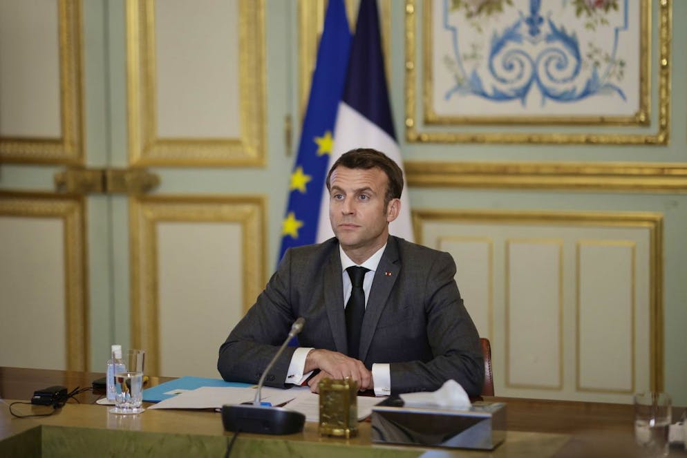 epa09049247 French President Emmanuel Macron participates in the Act-A videoconference meeting with the African Union board at the Elysee Palace in Paris, France, 03 March 2021. The Act-A launched by the World Health Organization is the initiative to coordinate a global response to the Covid-19 pandemic. EPA/YOAN VALAT / POOL