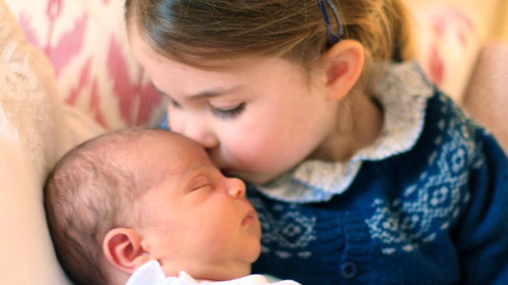 epa06714385 A handout photo made available by the Kensington Palace on 05 May 2018 and taken by Catherine, Duchess of Cambridge shows her daughter Princess Charlotte kissing her brother Prince Louis on her third birthday in London, Britain, 02 May 2018. Kensington Palace on 27 April 2018 has announced that the third child of Prince William, Duke of Cambridge and his wife Catherine, Duchess of Cambridge will be called Prince Louis Arthur Charles of Cambridge. He was born on 23 April. EPA/DUCHESS OF CAMBRIDGE HANDOUT HANDOUT EDITORIAL USE ONLY/NO SALES