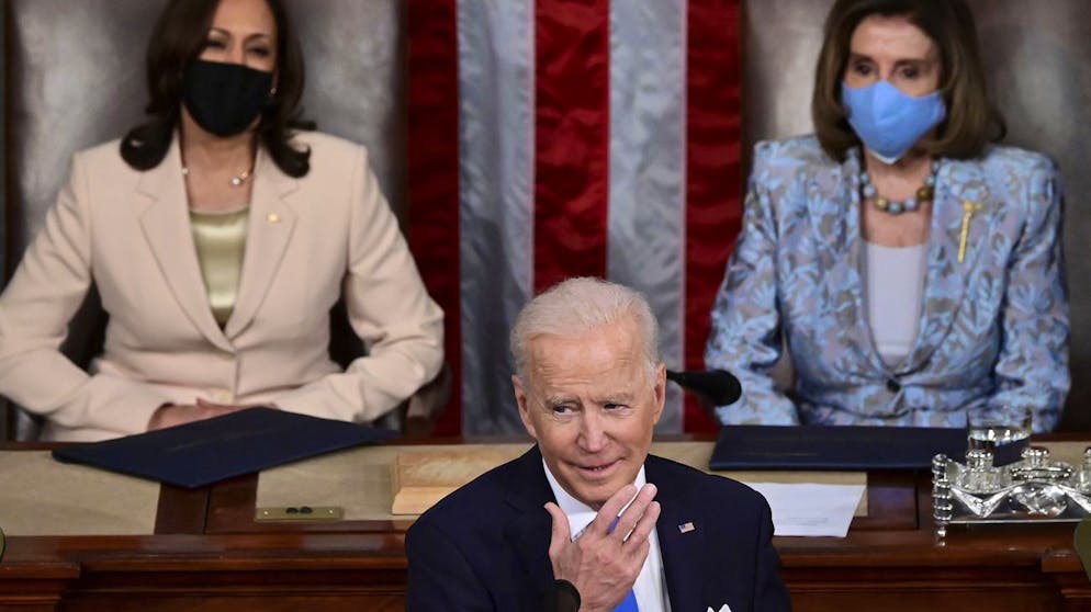 President Joe Biden addresses a joint session of Congress, Wednesday, April 28, 2021, in the House Chamber at the U.S. Capitol in Washington, as Vice President Kamala Harris, left, and House Speaker Nancy Pelosi of Calif., look on. (Jim Watson/Pool via AP)