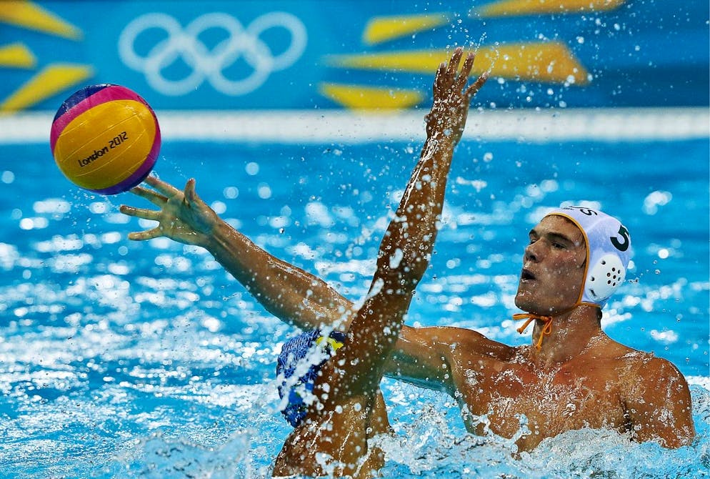 epa03329392 Aaron Younger (R) of Australia vies with Murat Shakenov (L) of Kazakhstan during the preliminary round match in the London 2012 Olympic Games Men Waterpolo competition, London, Britain, 31 July 2012. the London 2012 Olympic Games Water Polo competition, London, Britain, EPA/KERIM OKTEN
