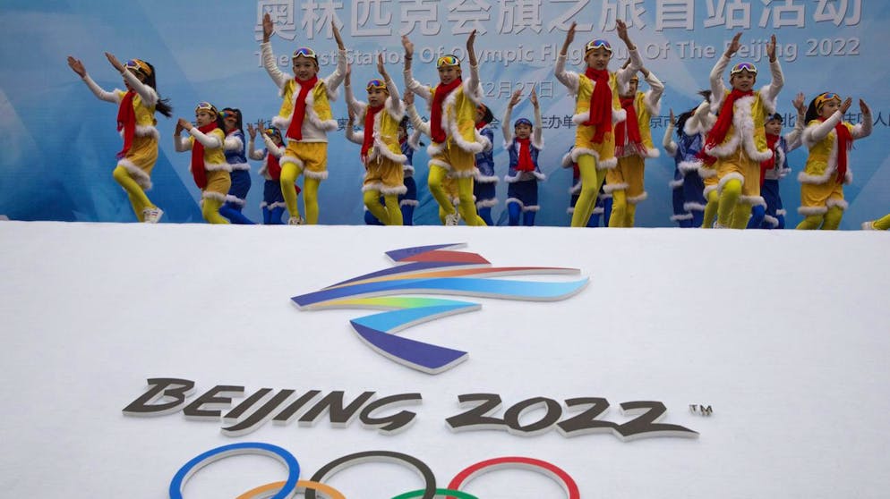 Chinese performers dance during a ceremony to mark the arrival of the Olympic flag and start of the flag tour for the Winter Olympic Games Beijing 2022 at a section of the Great Wall of China on the outskirts of Beijing Tuesday, Feb. 27, 2018.
