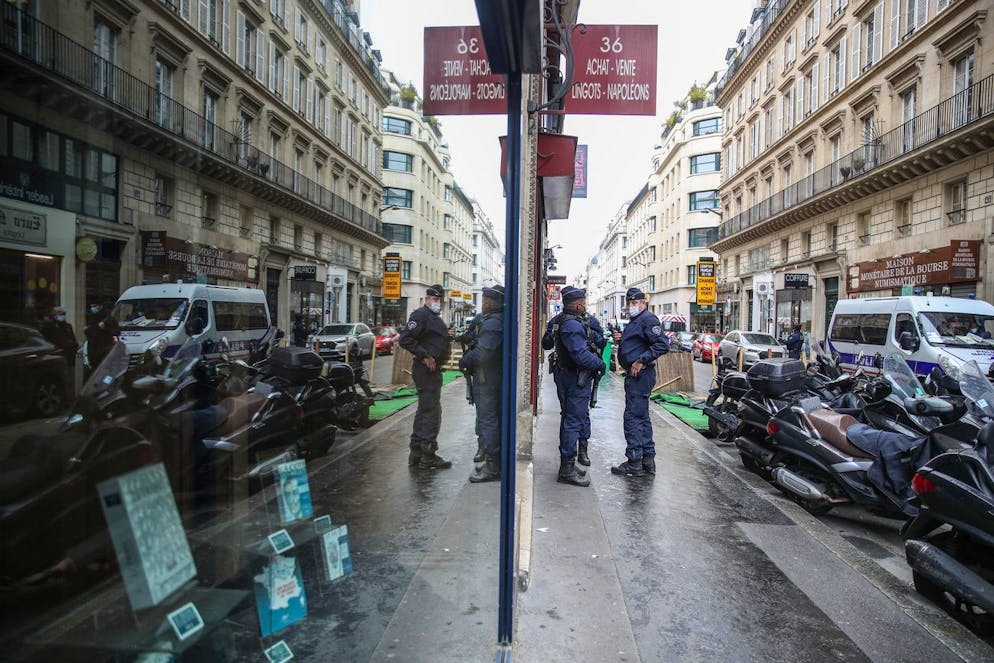 epa09119113 Policemen wearing face masks stand guard next to entrance of 'Palais Vivienne' which is owned by Pierre-Jean Chalençon, after allegations for orginizing clandestine dinner parties in Paris, France, 06 April 2021. After a report broadcast on M6 'Metropole Television', Pierre-Jean Chalençon is accused for organizing clandestine dinner at the Palais Vivienne on 01 April 2021. French authorities investigate clandestine dinner parties with ministers and wealthy guests that allegedly ignored Covid rules and pandemic restrictions. EPA/MOHAMMED BADRA