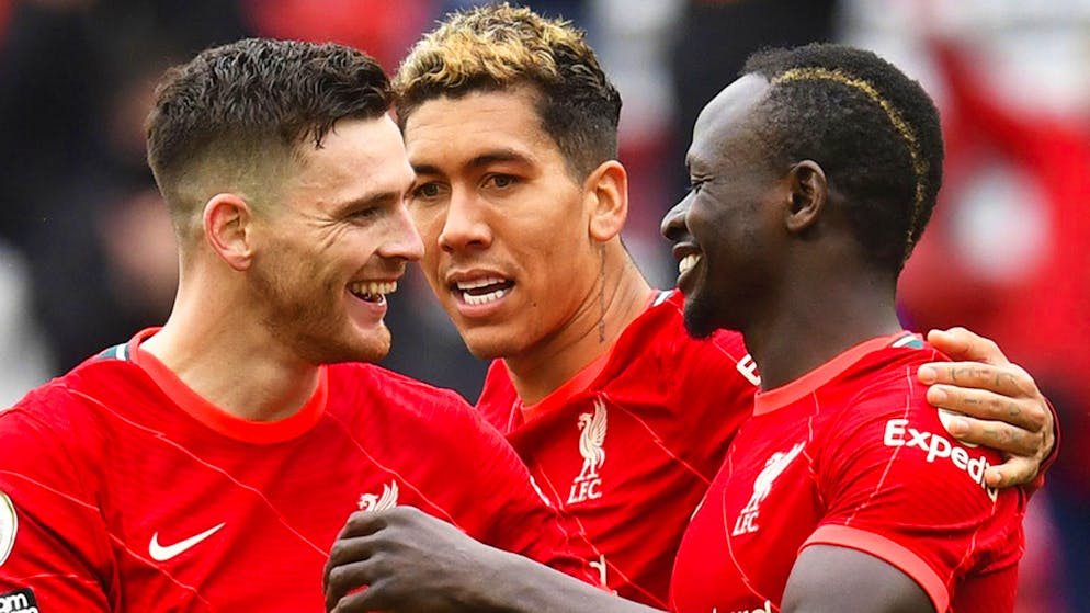 Liverpool's Sadio Mane, right, celebrates scoring his sides second goal during the English Premier League soccer match between Liverpool and Crystal Palace at Anfield stadium in Liverpool, England, Sunday, May 23, 2021. (Paul Ellis/Pool via AP)