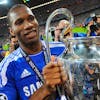 epa03230287 (FILE) A file picture dated 19 May 2012 shows Chelsea's Didier Drogba celebrating with the trophy after the team won the UEFA Champions League final between FC Bayern Munich and Chelsea FC in Munich, Germany. Ivory Coast striker Didier Drogba confirmed on 22 May 2012 that he will leave Chelsea on a free transfer at the end of June 2012 after eight years with the London club. EPA/TOBIAS HASE