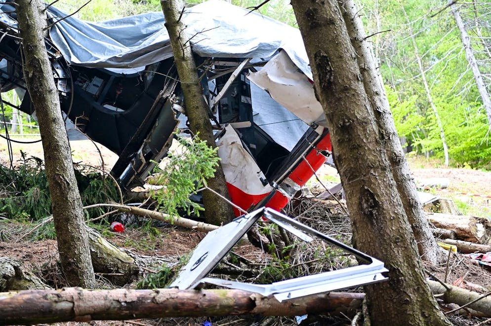 epa09229031 The site where the Stresa-AlpinoâÄ“Mottarone cable car crashed to the ground after a cable snapped on 23 May 2021, in Mottarone Stresa, northern Italy, 26 May 2021. The crash killed fourteen passengers in the cable car, and seriously injured one child. EPA/ALESSANDRO DI MARCO