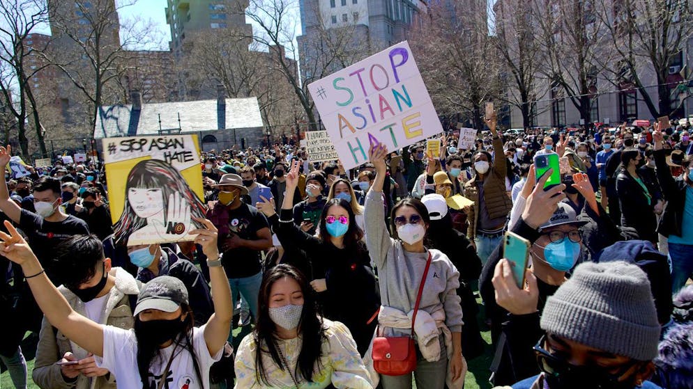 People take part in a rally against hate and the rising violence against Asians living in the U.S., at Columbus Park in the Chinatown section of the Manhattan borough of New York, on Sunday, March 21, 2021. (AP Photo/Eduardo Munoz Alvarez)