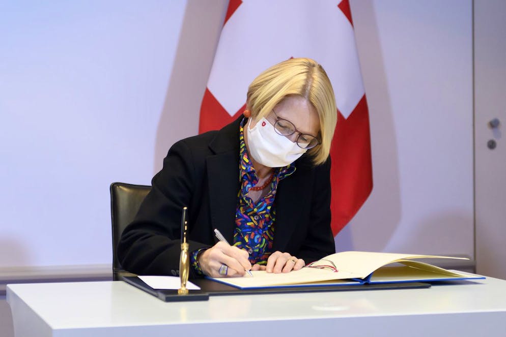 Swiss State Secretary Livia Leu, signs a bilateral state agreement in the field of radiometric controls at the borders, at Bellevue Palace, in Bern, Switzerland, this Friday, December 18, 2020.(KEYSTONE/Anthony Anex)