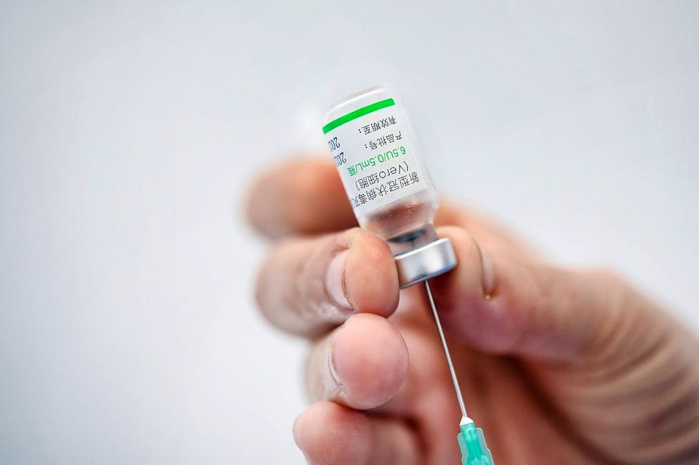 FILE - In this Friday, May 28, 2021 file photo, a healthcare worker prepares a dose of the Sinovac COVID-19 vaccine during a vaccination session for medical staff who work at private clinics in Caracas, Venezuela. The World Health Organization has issued an emergence use listing for the COVID-19 vaccine made by Sinovac in adults aged 18 and over, the second such authorization it has granted to a Chinese company. In a statement on Tuesday, June 1 the U.N. health agency said data submitted to its experts showed that two doses of the vaccine prevented people from getting symptoms of COVID-19 in about half of those who got the vaccine.(AP Photo/Matias Delacroix, file)