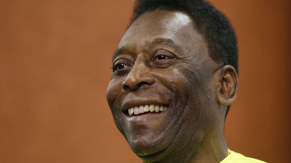 Brazilian soccer legend Pele smiles during a media opportunity at a restaurant in London, Friday, March 20, 2015. Pele is supporting Sepp Blatter's bid to continue running world football as the FIFA president prepares for his toughest-ever election battle. Blatter is taking on three rivals in FIFA's May election, including Pele's friend, Luis Figo, the former Portugal, Barcelona and Real Madrid player. (AP Photo/Kirsty Wigglesworth)