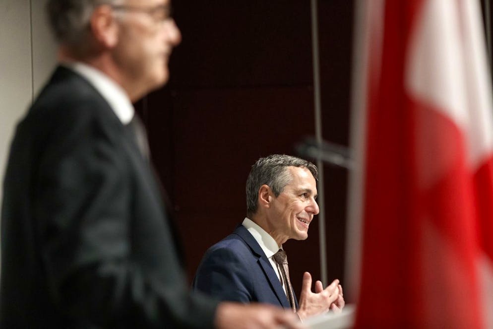 Swiss President Guy Parmelin, left, and Ignazio Cassis, right, Federal Councillor, speak during a press conference after a meeting with United States President Joe Biben Tuesday, June 15, 2021 in Geneva, Switzerland. The meeting between US President Joe Biden and Russian President Vladimir Putin is scheduled in Geneva for Wednesday, June 16, 2021. (KEYSTONE/Cyril Zingaro)