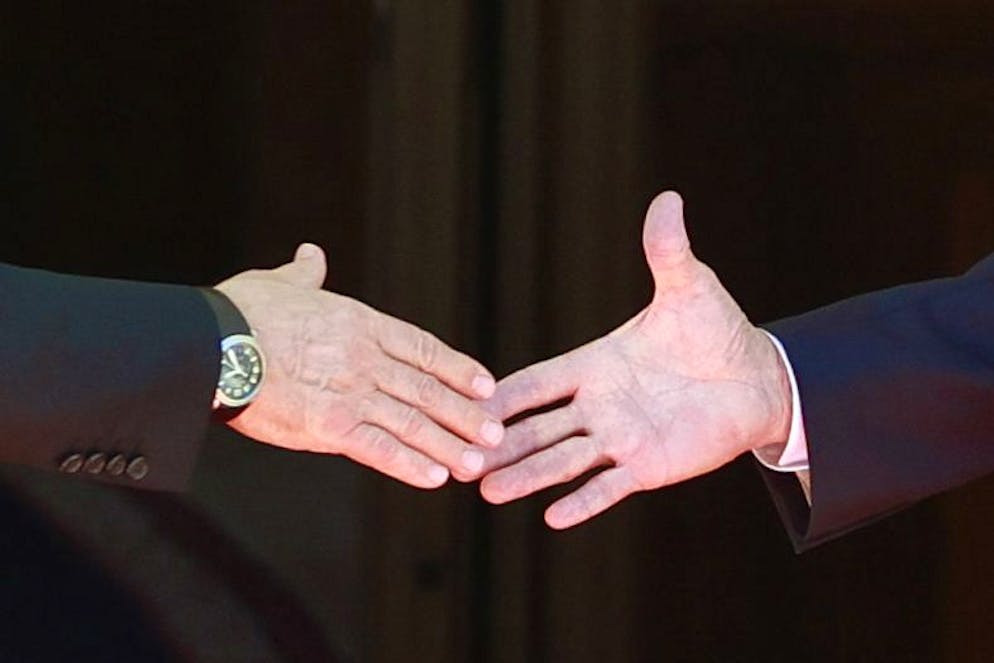 U.S. President Joe Biden, right, and Russia's President Vladimir Putin, left, shake hands during the U.S.-Russia summit at Villa La Grange in Geneva, Switzerland, Wednesday, June 16, 2021. (KEYSTONE/REUTERS POOL/Denis Balibouse)