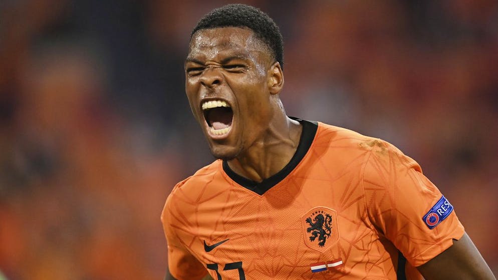 Denzel Dumfries of the Netherlands celebrates after scoring his side's second goal during the Euro 2020 soccer championship group C match between the The Netherlands and Austria at Johan Cruijff ArenA in Amsterdam, Netherlands, Thursday, June 17, 2021. (John Thys, Pool via AP)
